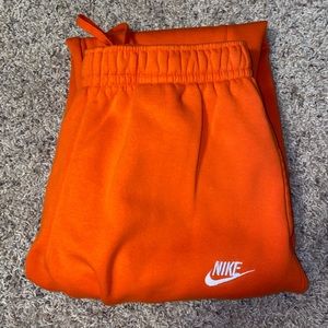 orange nike joggers
